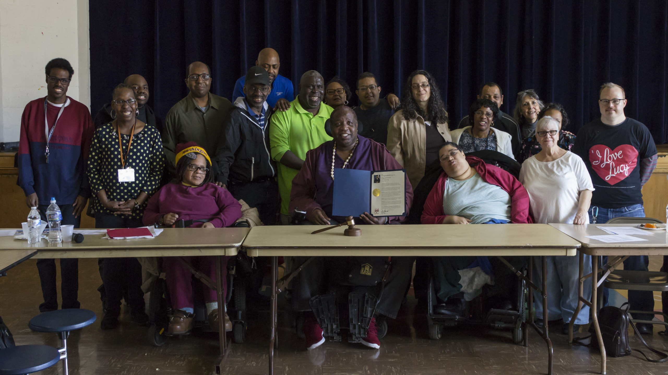 Group picture of Self Advocates smiling with Proclamation