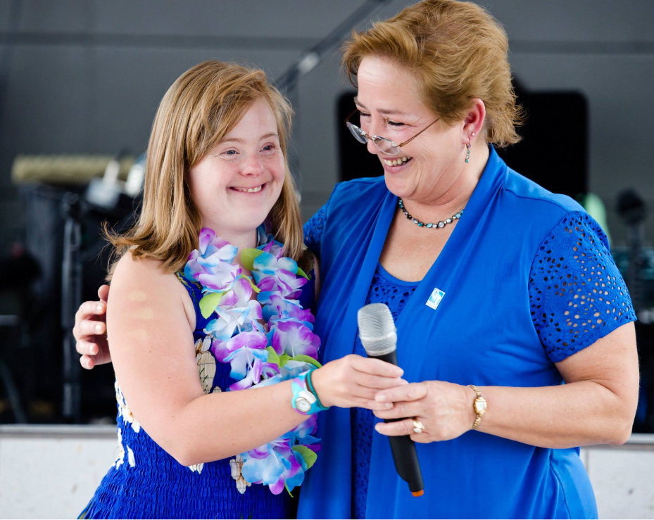 woman standing with girl who has downs syndrome